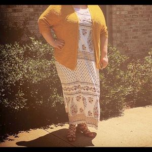 White dress with blue burnt orange and mustard yellow details